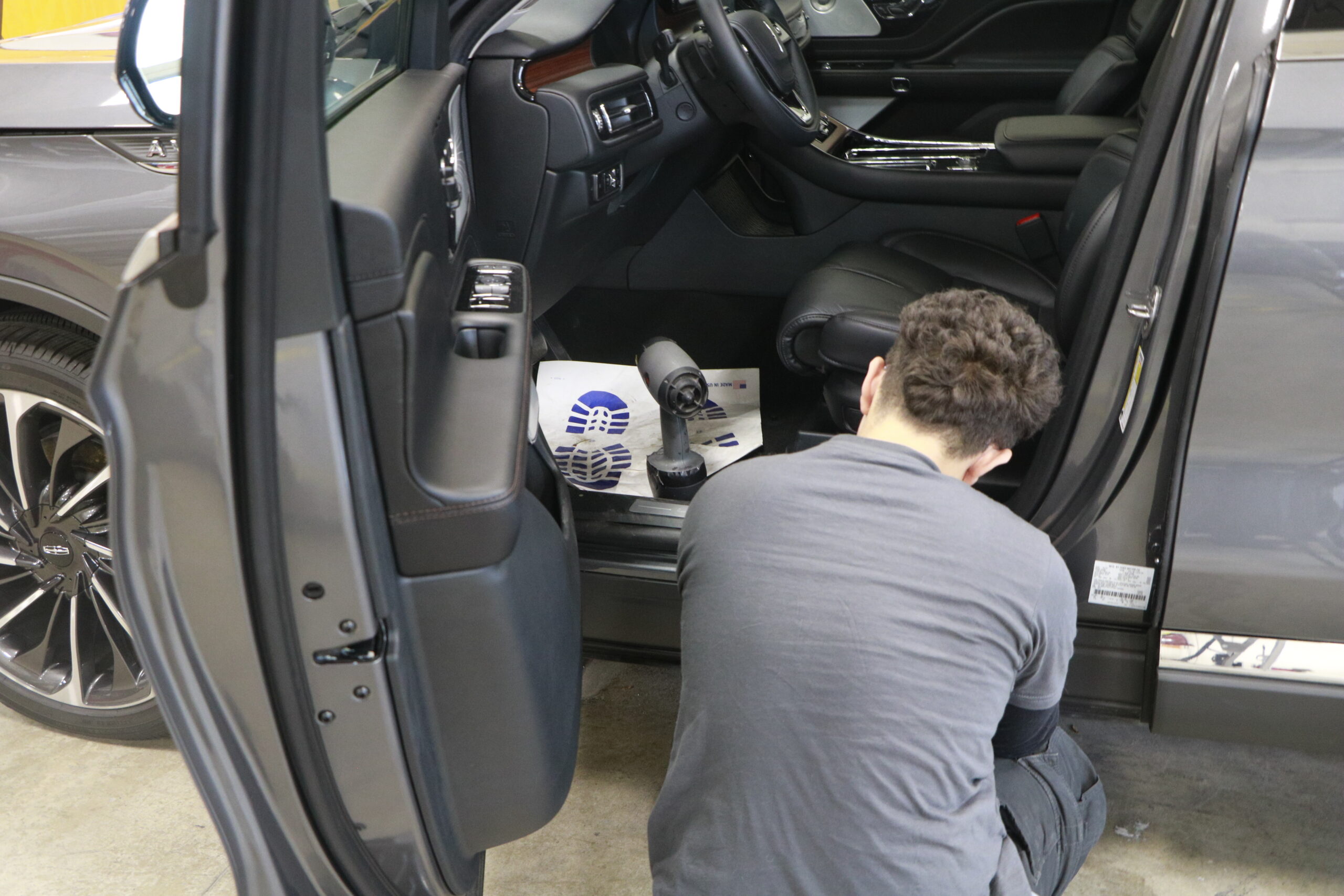 Student working on car