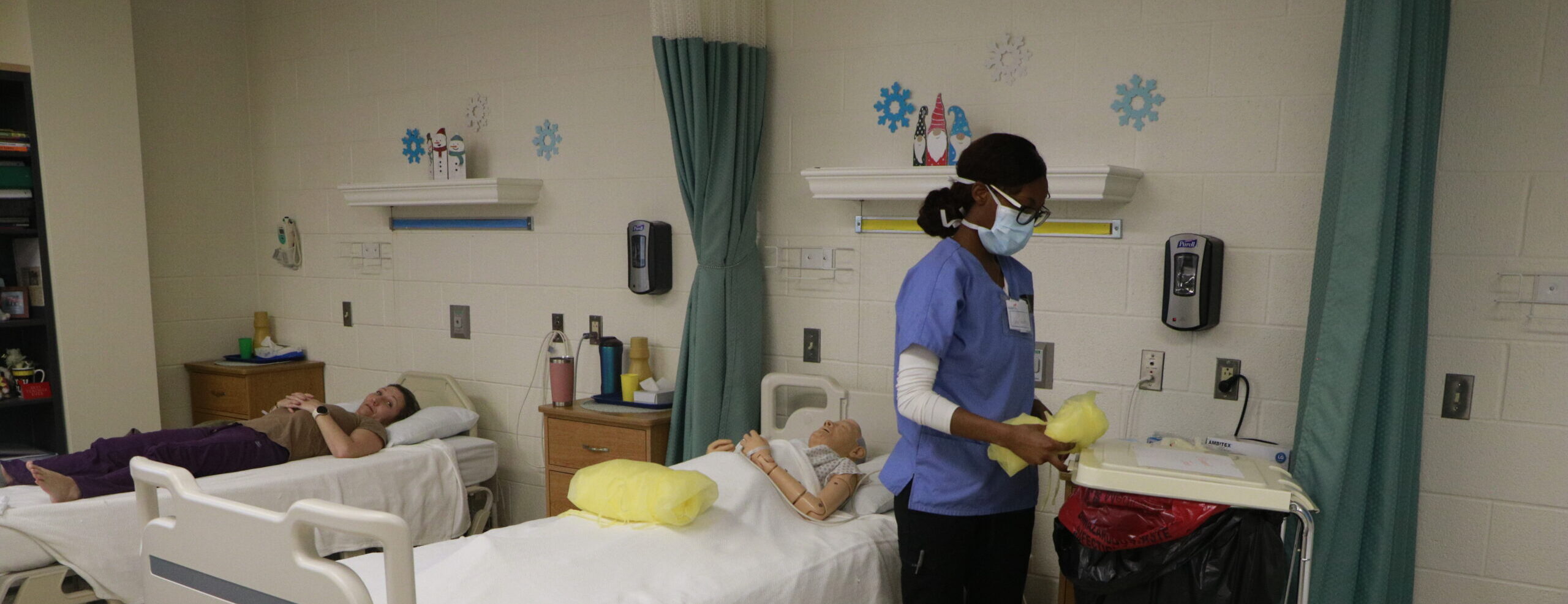 Student operating on manequins