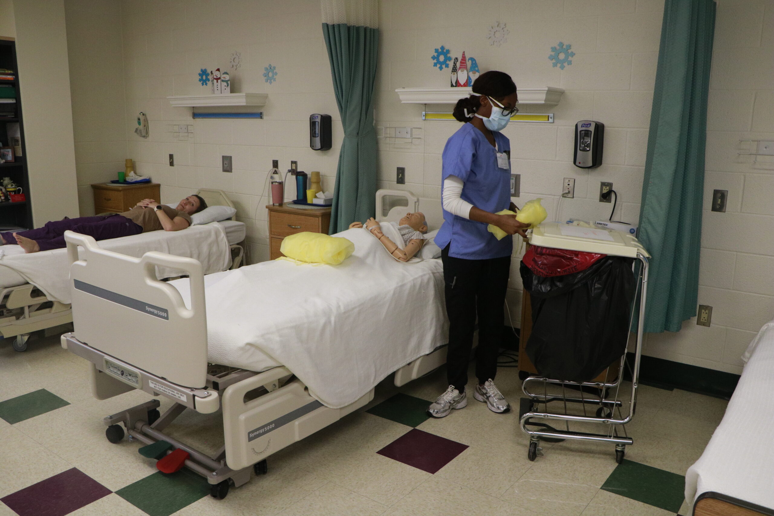 Student operating on manequins