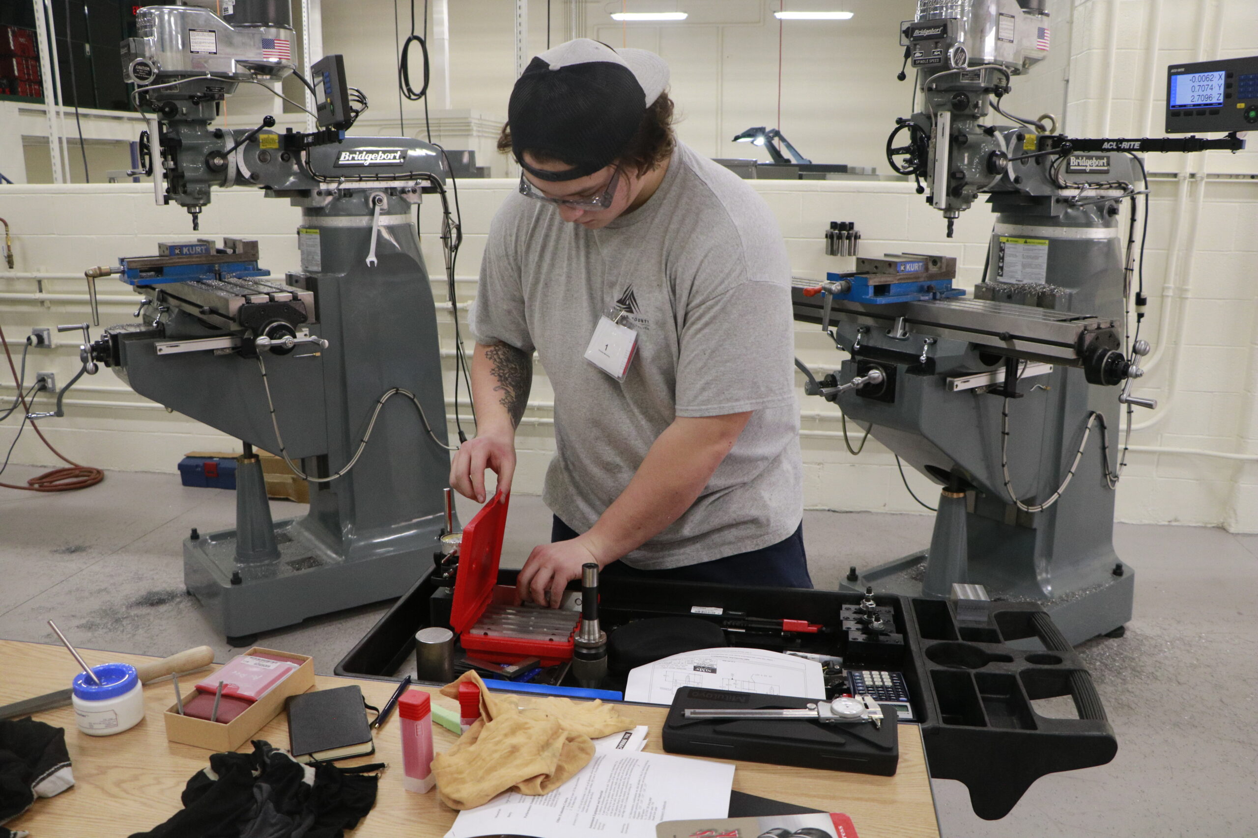 Student grabbing tools from tool box